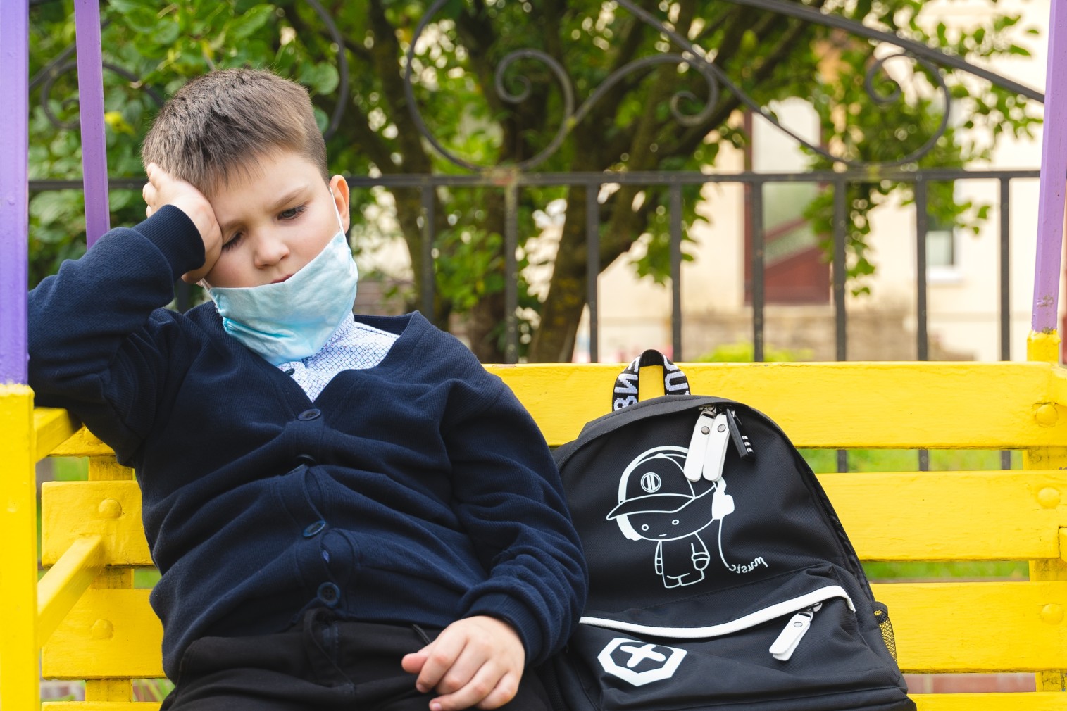 nominated-thoughtful-kid-in-mask-wants-ending-quarantine-sad-school-boy-looking-sitting-on-a-bench_t20_VWB2JP.jpg
